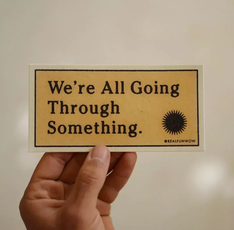 We're All Going Through Something' Bumper Sticker